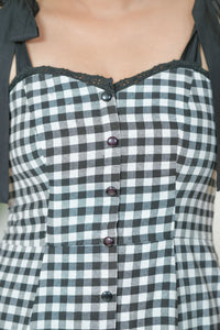 Black and white gingham midi dress - back view showing bow tie straps