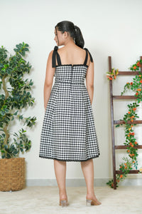 Black and white gingham midi dress - side view showing A-line silhouette