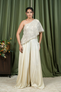 Ivory one-shoulder embroidered cape top and palazzo co-ord set - front view
