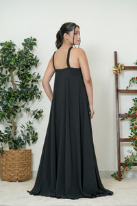 Black chiffon cross-halter maxi gown - back view showing open back and criss-cross strap detail