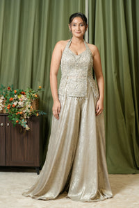 Close-up of pearl and crystal hand embroidery on halter top