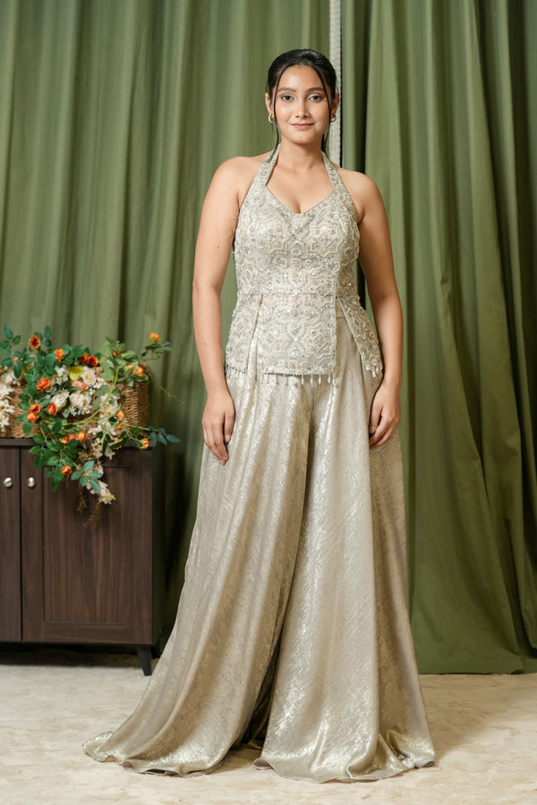 Close-up of pearl and crystal hand embroidery on halter top