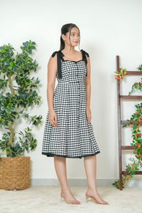 Close-up of sweetheart neckline with black lace trim and snap button placket detail