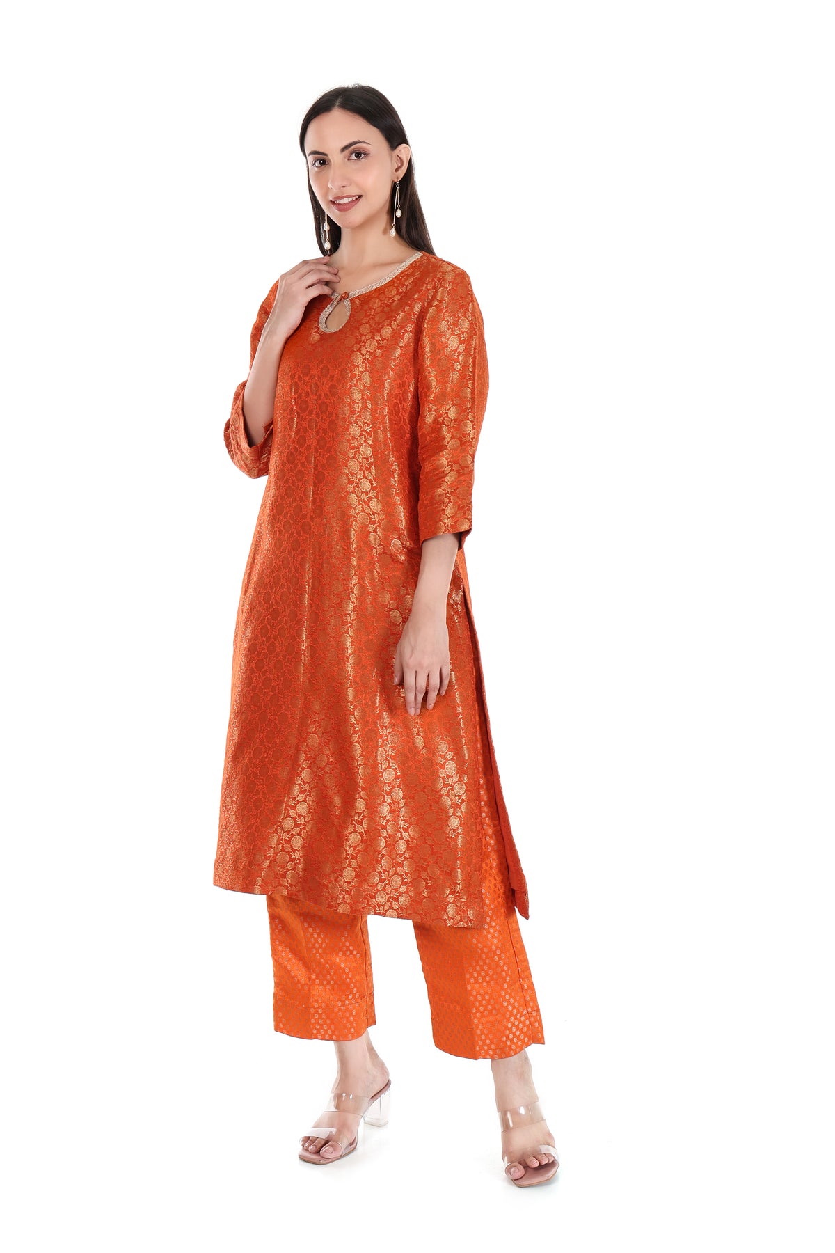 Angled view of orange floral kurta set showing keyhole neckline and three-quarter sleeves