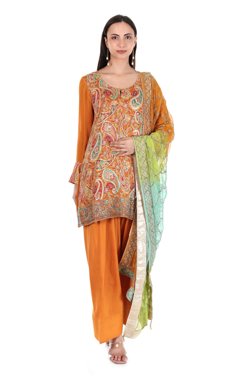 Front view of mustard orange paisley kurta and palazzo set with multicolour dupatta