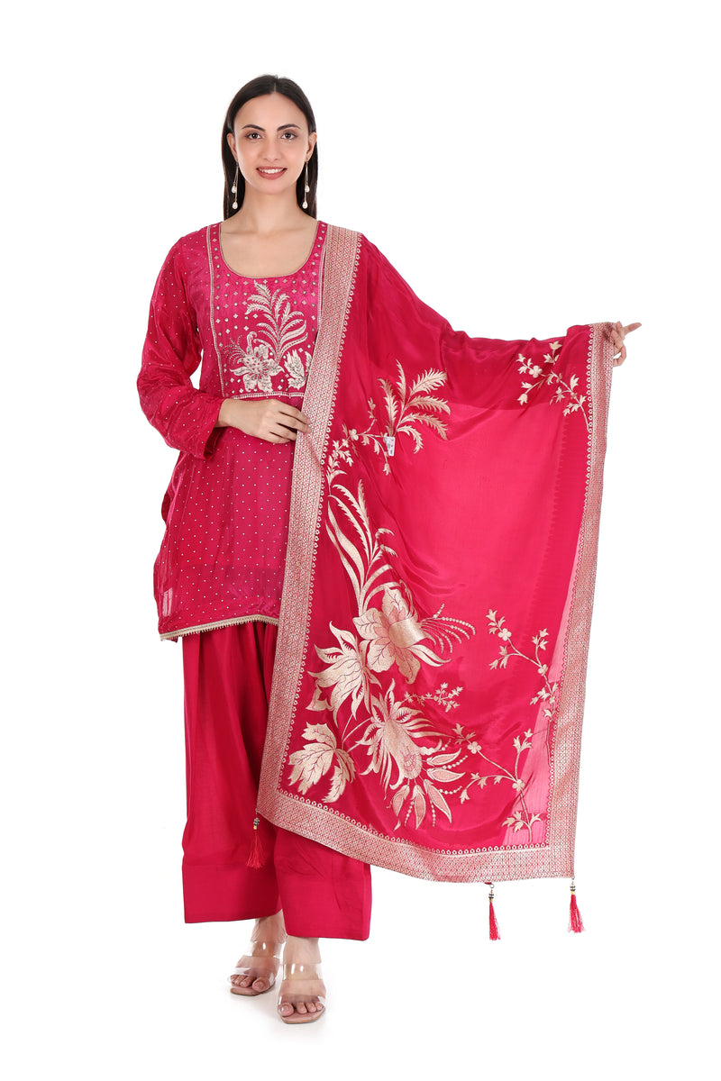 Front view of rani pink floral-yoke kurta and palazzo set with botanical dupatta displayed