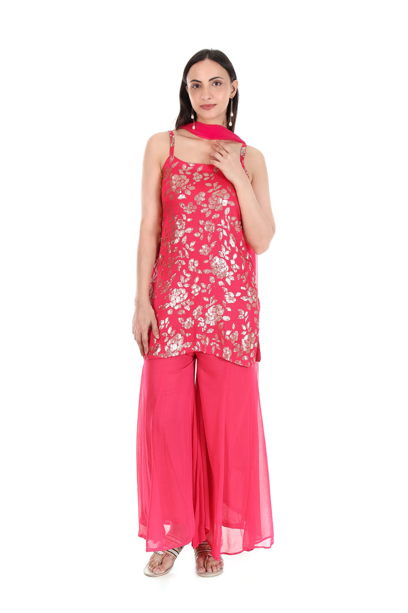 Front view of rani pink metallic floral kurta with palazzo trousers and matching dupatta