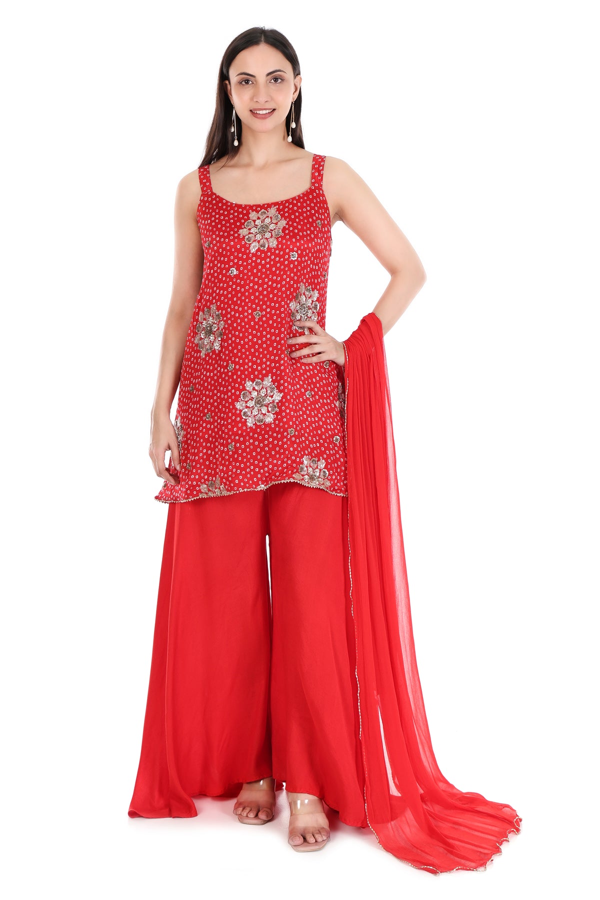 Side view of red sleeveless kurta and wide-leg palazzo set