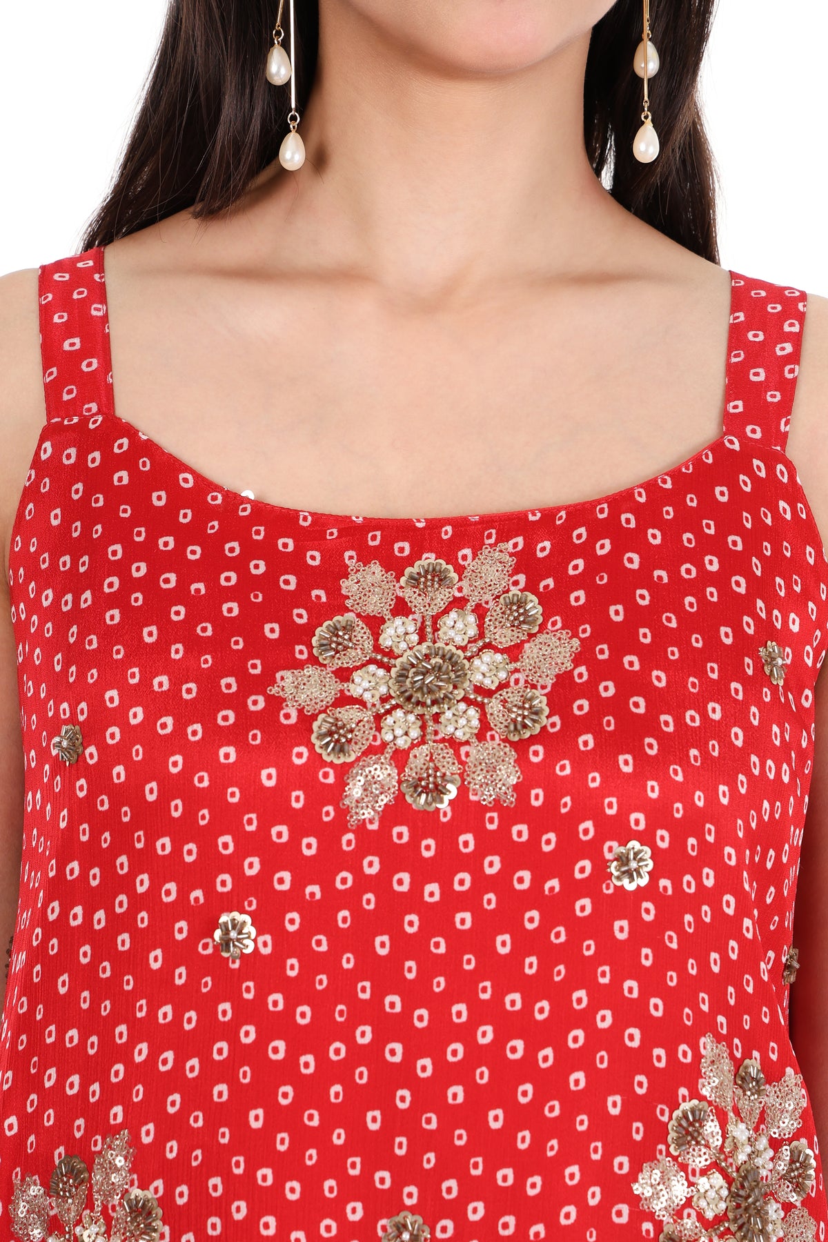 Back view of red sleeveless patterned kurta and solid wide-leg palazzo trousers