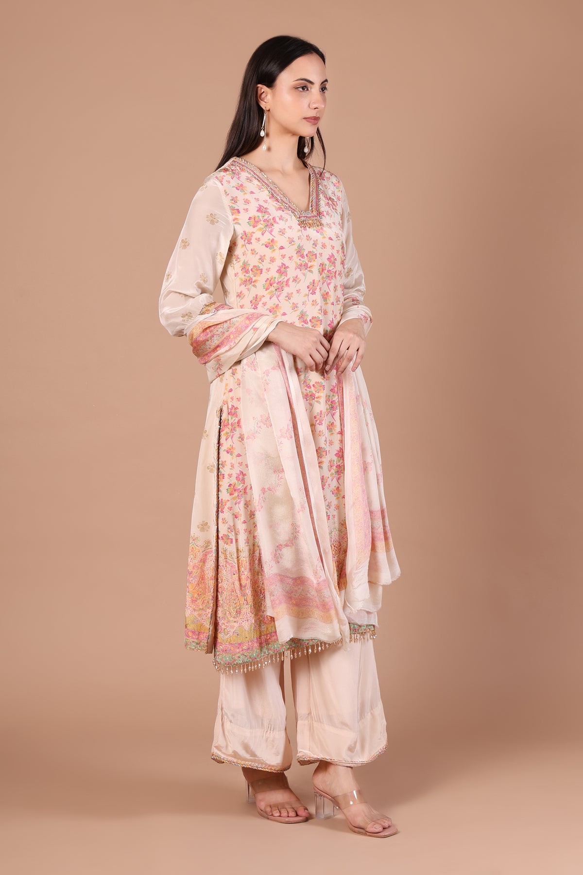 Front view of ivory and blush floral kurta palazzo set with matching bordered dupatta